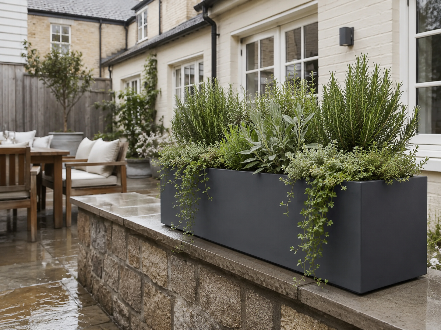 IDEALIST outdoor window box with herbs on a compact patio